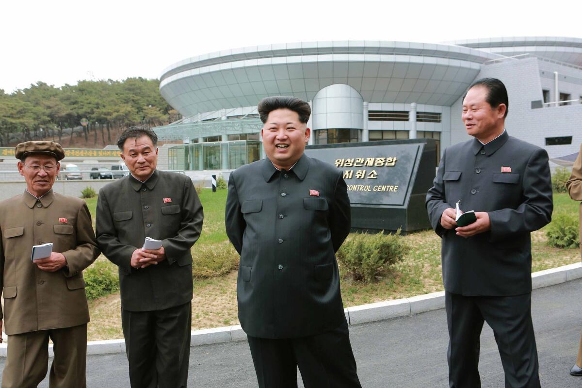 North Korean leader Kim Jong-un, second from right, takes part in an inspection of a new satellite control center at an undisclosed location.
