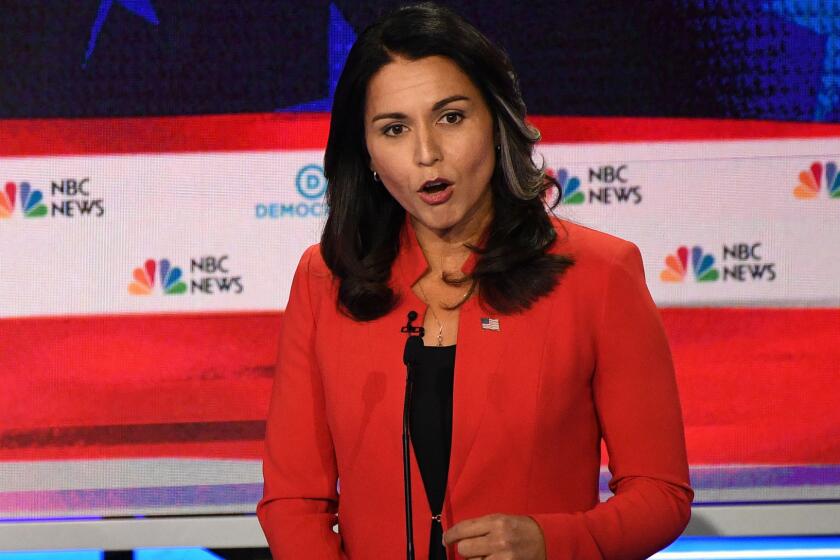 Rep. Tulsi Gabbard (D-Hawaii) donned a blazing red jacket, worn over a black shirt and pair of black pants.
