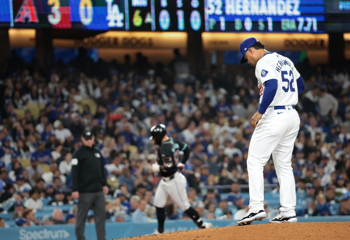 Elieser Hernández on the mound as Arizona rounds third.