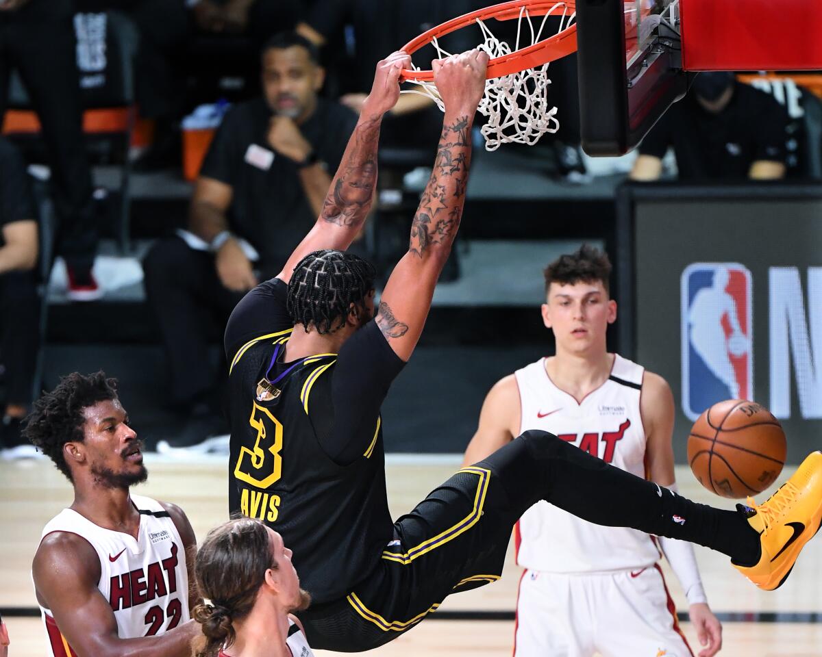 Lakers forward Anthony Davis throws down a dunk in the fourth quarter of Game 2 against the Heat on Friday night.