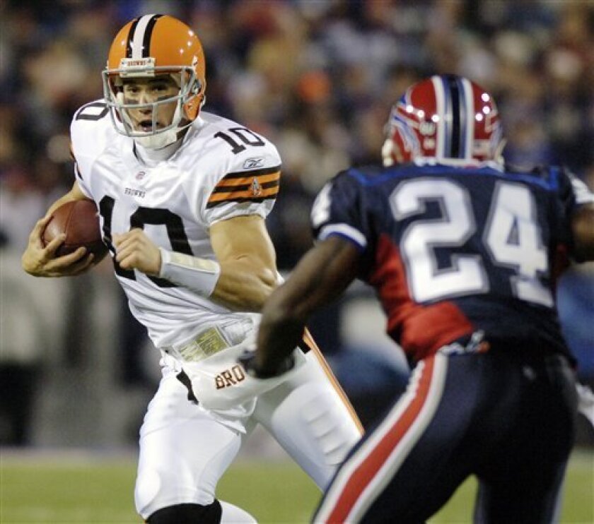 Cleveland Browns quarterback Brady Quinn (10) runs under pressure from Buffalo Bills' Terrence McGee (24) during the first quarter of the NFL football game at Ralph Wilson Stadium in Orchard Park, N.Y., Monday, Nov. 17, 2008. (AP Photo/Don Heupel)