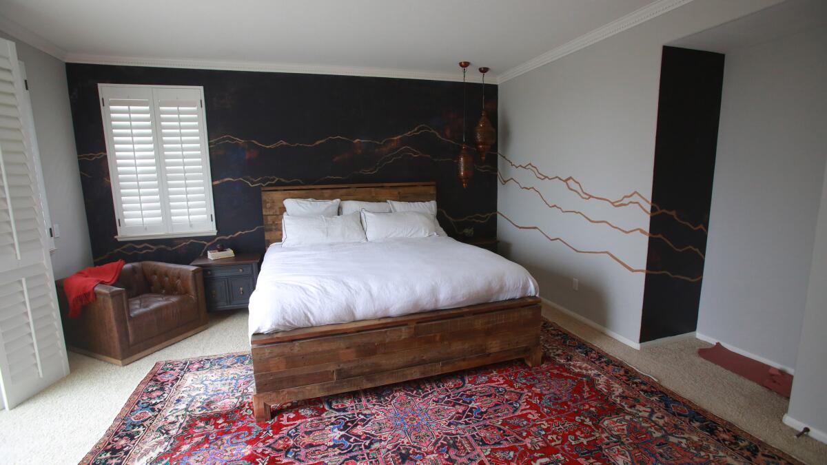 Ceballos’ Rocky Mountain range sketch on Chris and Hayley Filasky’s master bedroom walls has special significance. The couple met in Vail, Colo.