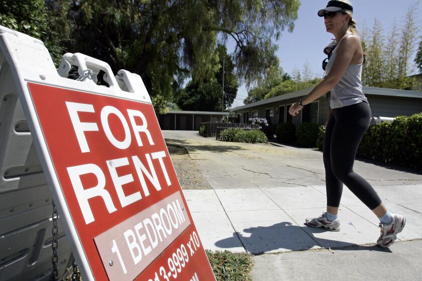FILE - In this July 19, 2006 file photo, a woman walks next to a "For Rent" sign at an apartment complex in Palo Alto, Calif. Many tenants aren’t familiar with the ins and outs of their renters insurance policies, but what they don’t know could cost them money (AP Photo/Paul Sakuma, File)