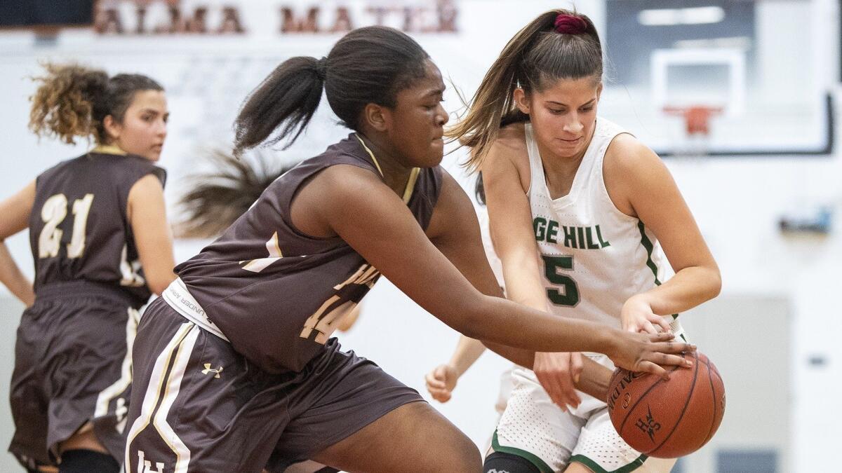 Sage Hill School's Zoe Mazakas battles for a loose ball with Laguna Hills' Imaan Ibrahaim in an Ultimate Flight game at the Hawk Holiday Classic at Los Amigos High on Friday.