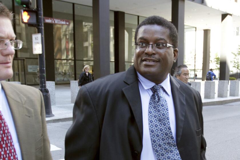 In this Oct. 9, 2013 photo, former Chicago Police Sgt. Ronald Watts, right, leaves the Dirksen U.S. Courthouse after being sentenced to 22 months in prison. Chicago has paid out more than $650 million in police misconduct cases over the past 15 years or so, and that expenditure is expected to increase yet more. In recent months, a growing roster of men who contend they were framed by former Detective Reynaldo Guevara for murders they didnât commit or by Watts on trumped up drug charges are seeing their convictions and are suing the city. (Phil Velasquez/Chicago Tribune via AP)