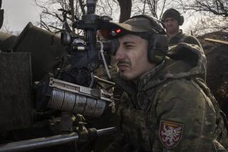 FILE -Ukrainian soldiers of 80th separate airborne assault brigade fires a D-30 cannon towards Russian positions at the front line, near Klishchiivka, Donetsk region, Ukraine, Saturday, March 2, 2024. Ukraine’s parliament has passed a controversial law that will govern how the country recruits new soldiers to replenish depleted forces who are increasingly struggling to fend off Russian troops. (AP Photo/Efrem Lukatsky, File)