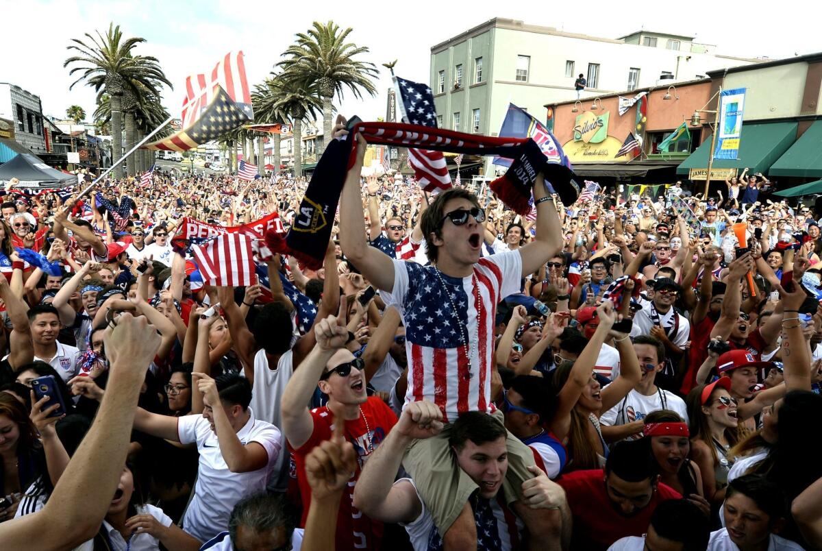 Soccer fans celebrate in Hermosa Beach June 16 after the U.S. team scored to give them a 2-1 lead over Ghana during the FIFA World Cup 2014 match.