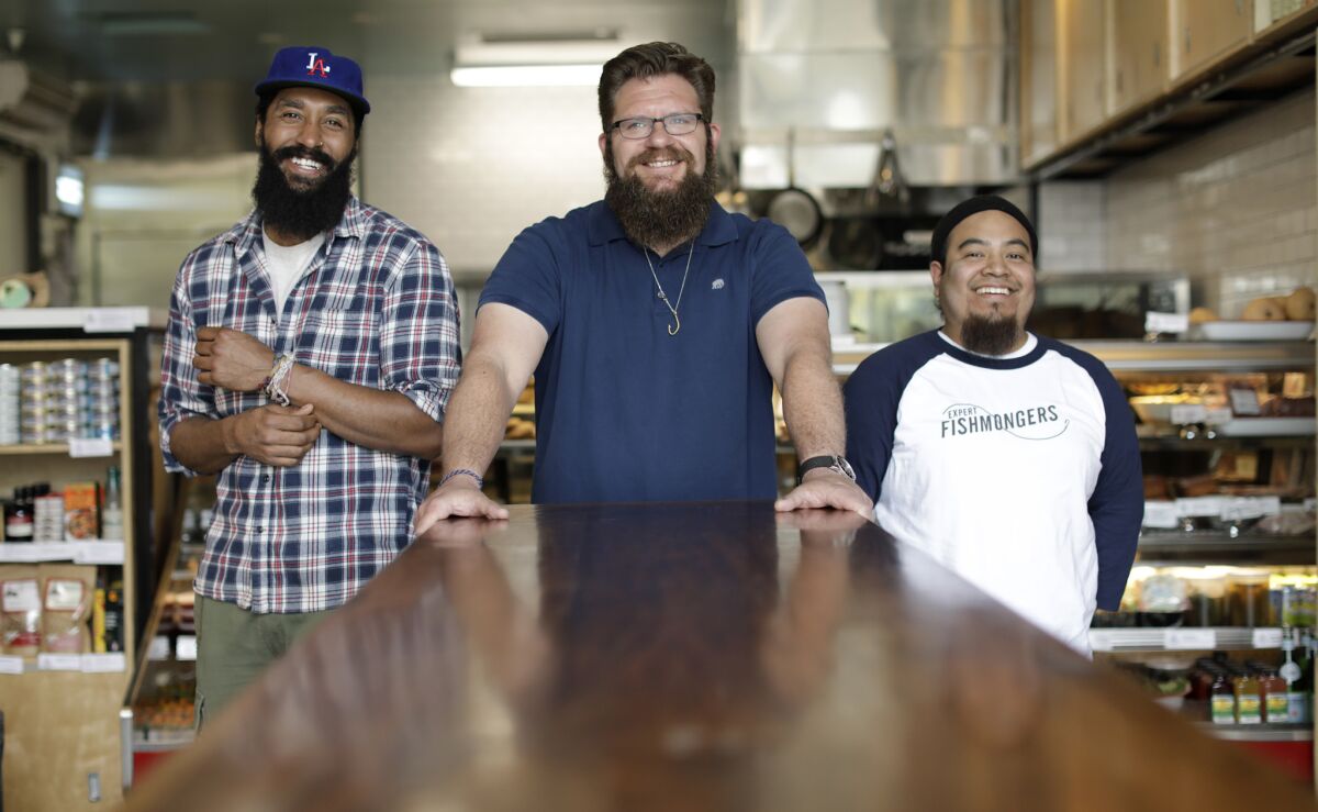 Cape Seafood and Provisions leaders, from left, culinary director Brandon Gray, chef and owner Michael Cimarusti and Ehder Dominguez, the manager and head fishmonger in the kitchen.