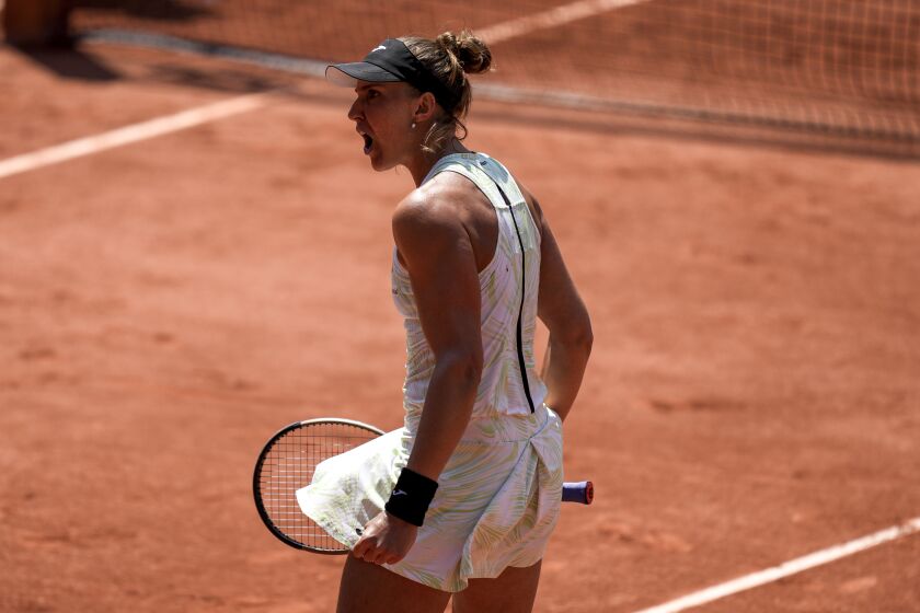 Brazil's Beatriz Haddad Maia celebrates after winning the second set against Tunisia's Ons Jabeur during their quarterfinal match of the French Open tennis tournament at the Roland Garros stadium in Paris, Wednesday, June 7, 2023. (AP Photo/Thibault Camus)