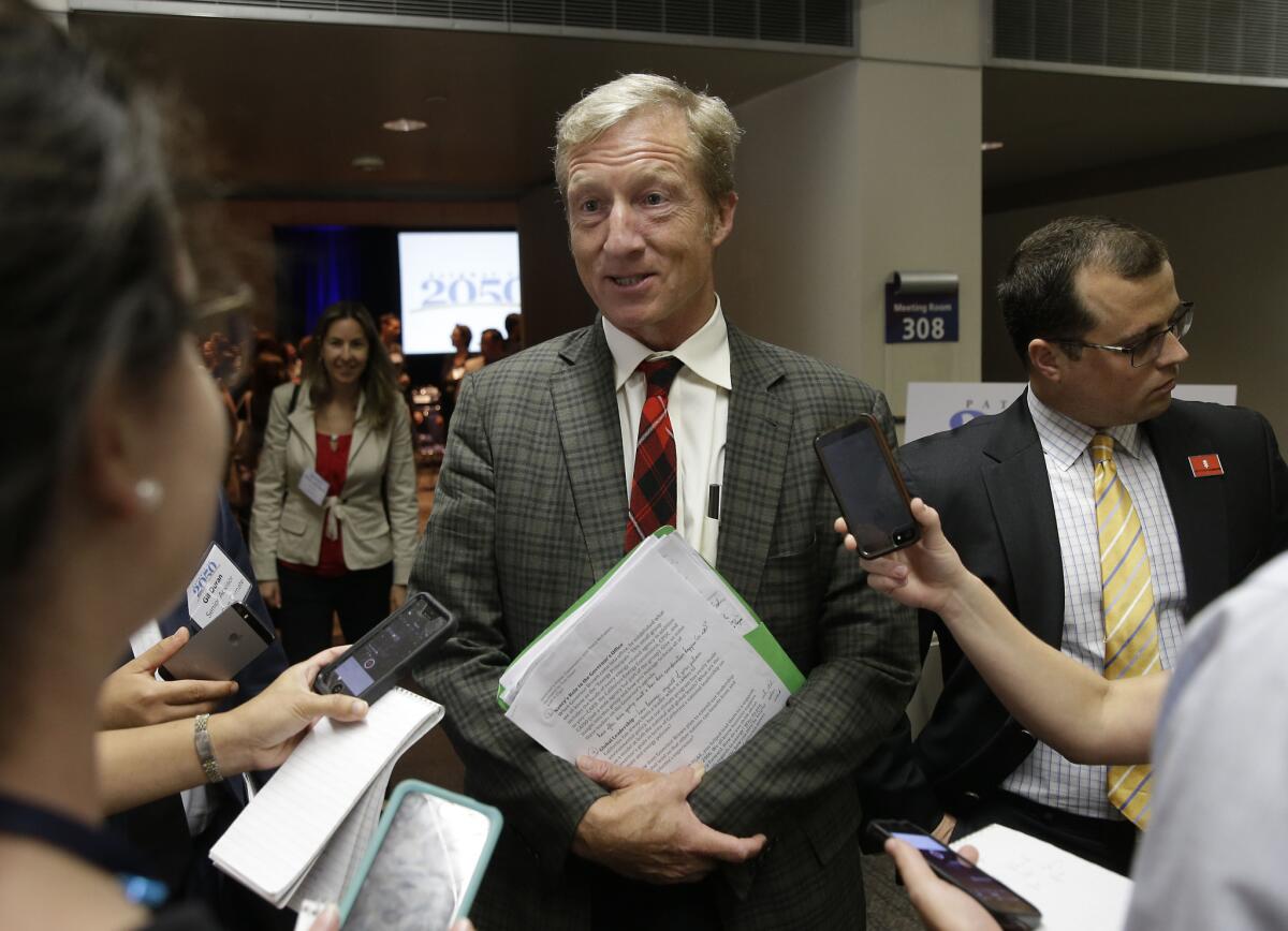 Billionaire Tom Steyer talks with reporters in Sacramento in August. On Thursday, he donated $1 million to the campaign for a ballot measure to raise the tobacco tax in California.