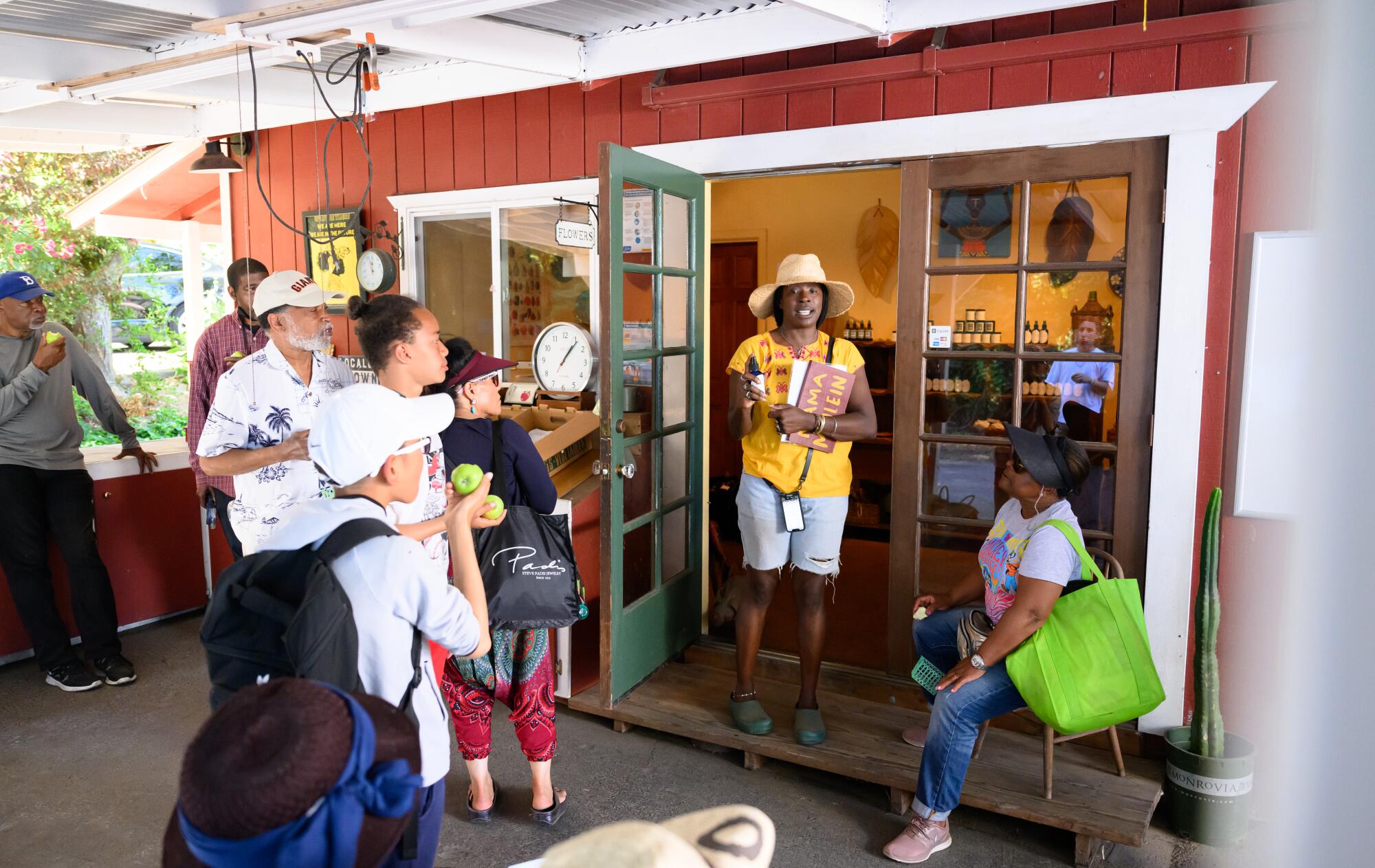 Farm founder Pandora Thomas speaks to a U-Pick group at EARTHseed Farm