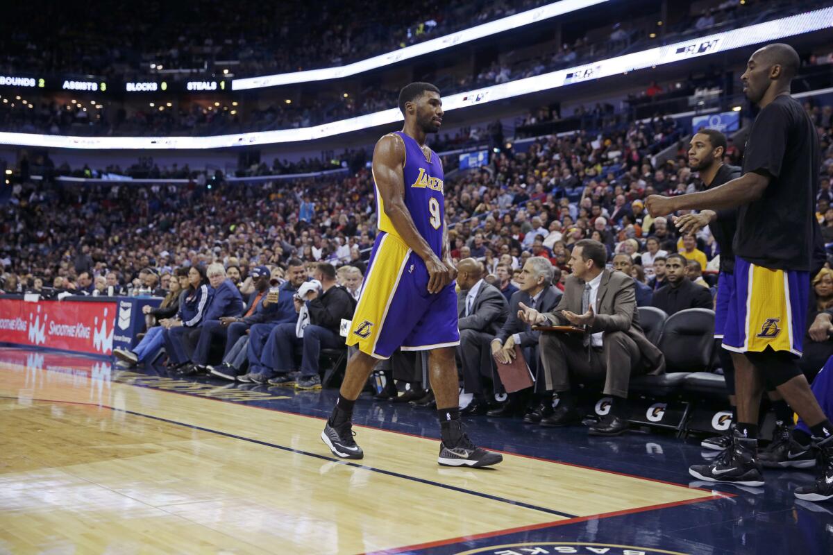 Lakers guard Ronnie Price walks off the court after being ejected for a flagrant foul 2 against New Orleans on Wednesday.
