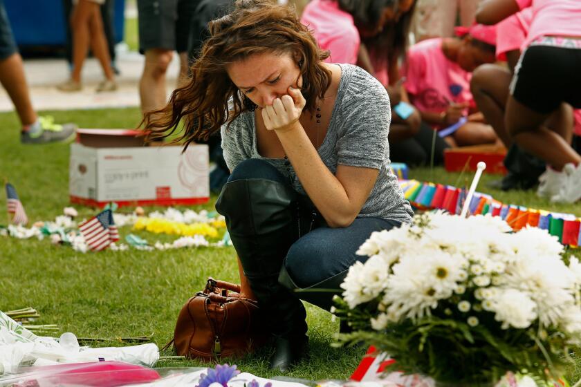 Danielle Irigoyen brings flowers to the victims of the Pulse nightclub shooting in Orlando, Fla. "I'm very close to many of the people who go to Pulse. Pulse was a safe place for us all," she said.