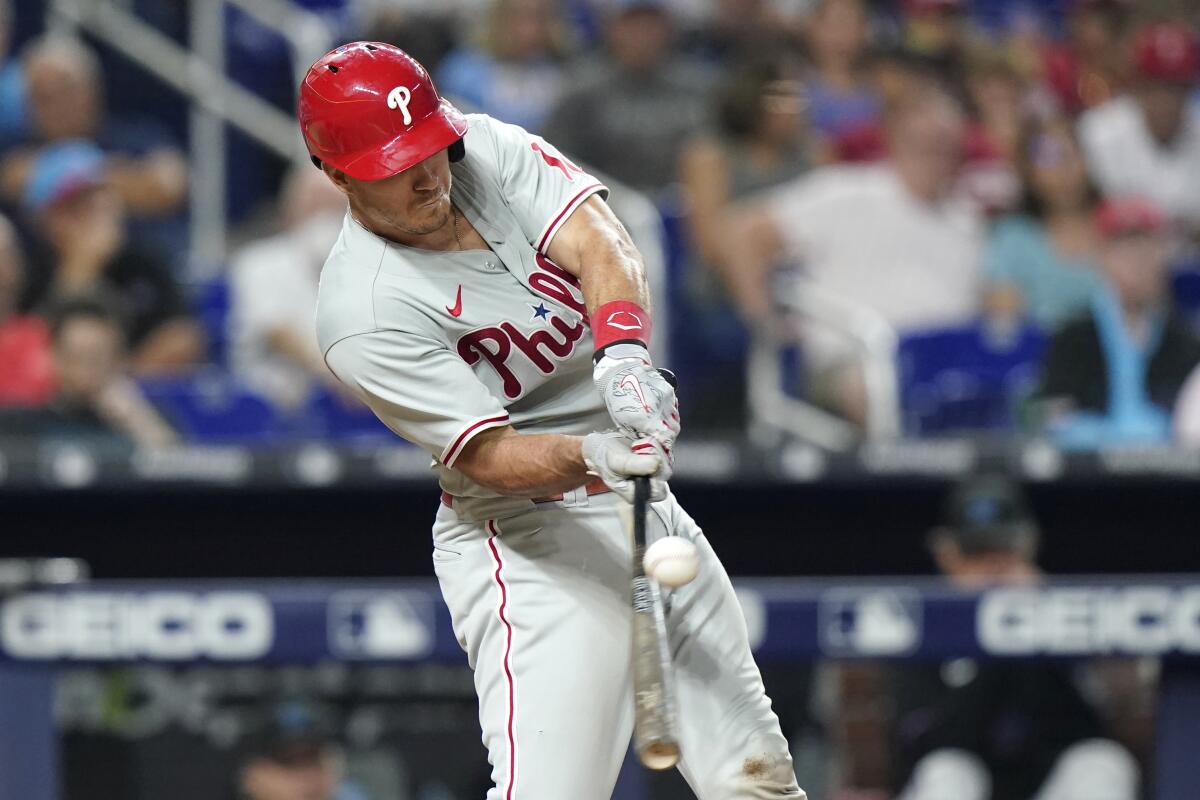 Philadelphia Phillies' J.T. Realmuto hits a single during the ninth inning of the team's baseball game against the Miami Marlins, Friday, July 15, 2022, in Miami. The Phillies won 2-1. (AP Photo/Lynne Sladky)