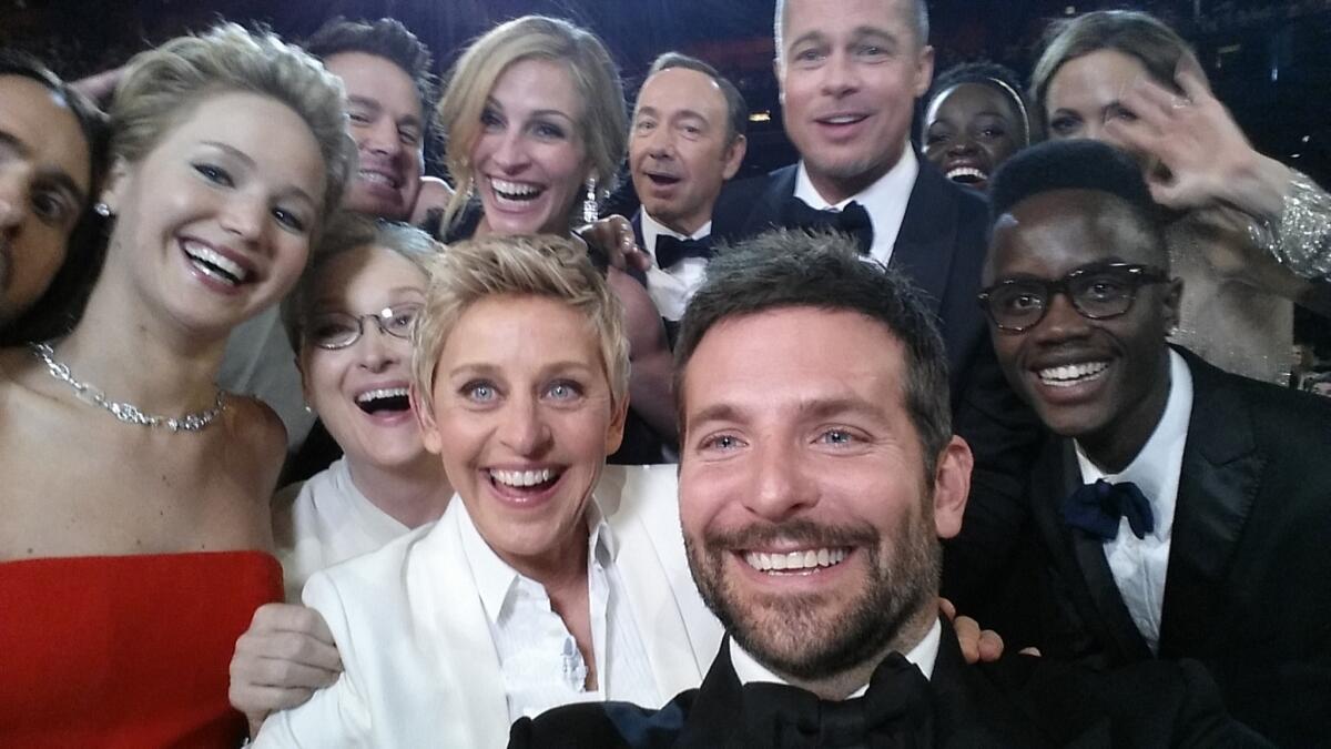 Host Ellen DeGeneres poses for a selfie taken by Bradley Cooper taken during the 2014 Oscars. That ceremony was watched by nearly 44 million viewers.