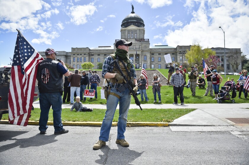 Protesters gather outside the Montana state Capitol in Helena, Mont., on May 20. 