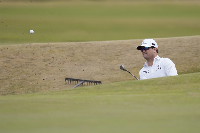 Zach Johnson plays out of a bunker on the 17th hole during a practice round on the Old Course at St Andrews.
