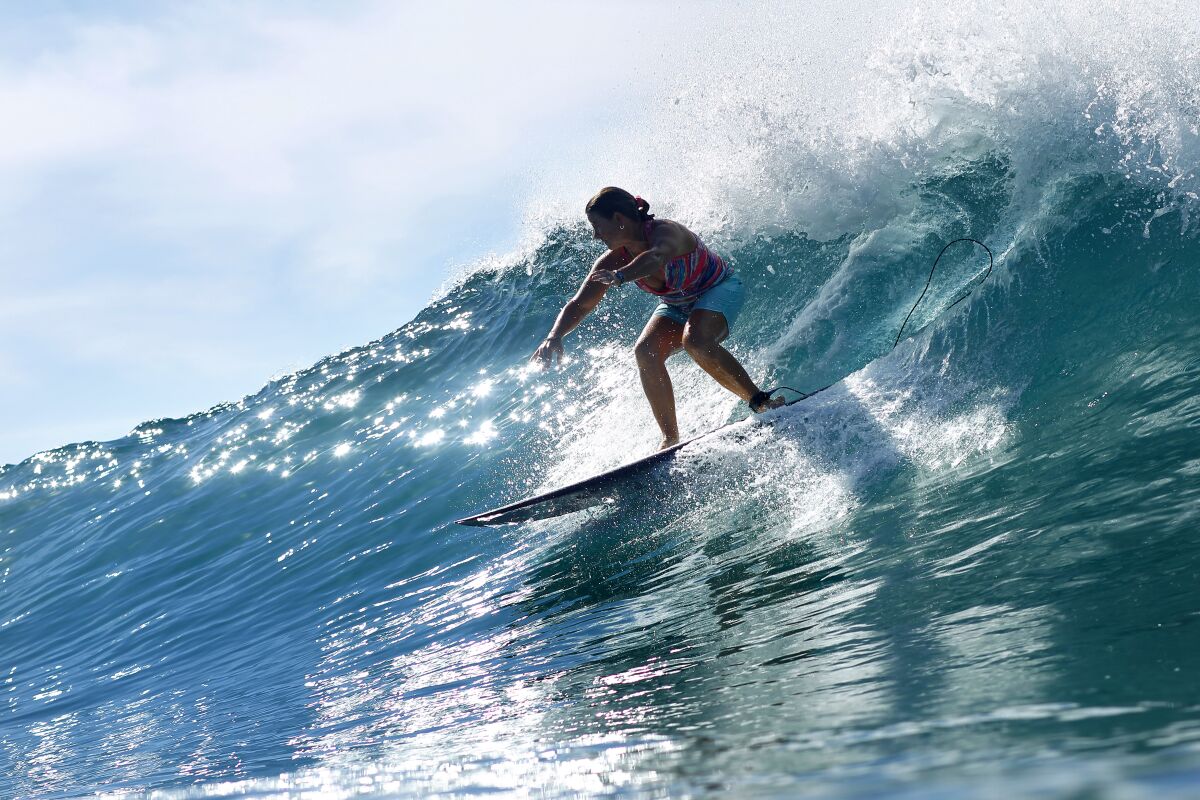 A surfer rides a wave at Swami's in Encinitas.