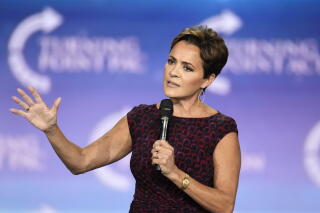 Kari Lake speaks to supporters at a campaign event