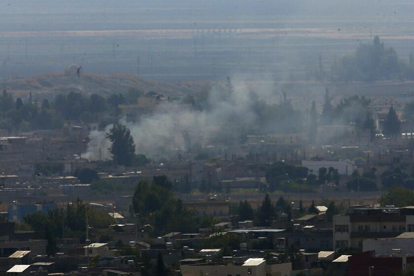 Smoke billows from targets in Ras al-Ayn, Syria, after shelling by Turkish forces Friday.