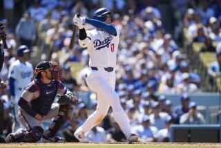 Los Angeles Dodgers designated hitter Shohei Ohtani (17) hits a home run during the eighth inning of a baseball game against the Atlanta Braves in Los Angeles, Sunday, May 5, 2024. (AP Photo/Ashley Landis)