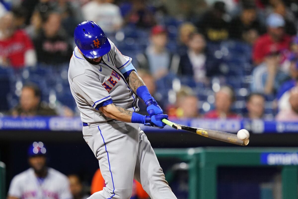 New York Mets' Tomas Nido breaks his bat on a ground out during the eighth inning of a baseball game against the Philadelphia Phillies, Thursday, May 5, 2022, in Philadelphia. (AP Photo/Matt Slocum)