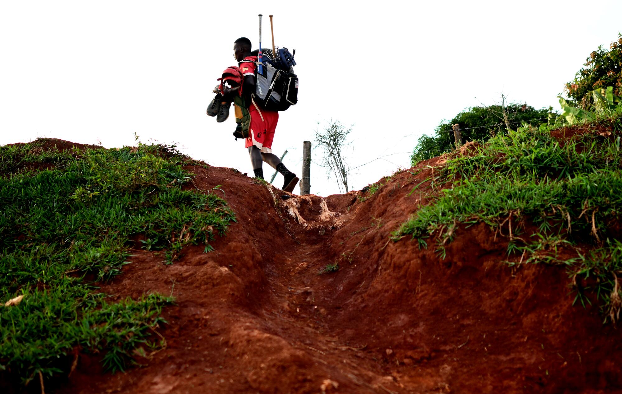 After a long day of practice, Dennis Kazumba heads home for a break and then another evening practice.