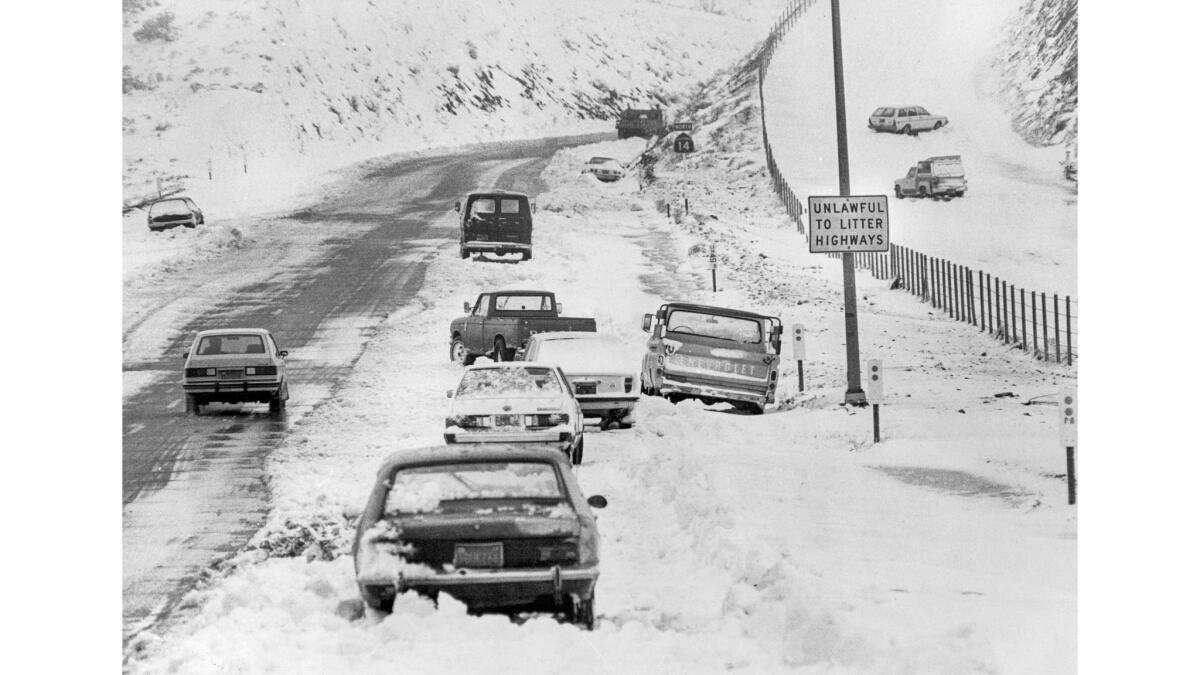 Feb. 3, 1983: After a winter storm, cars without chains sit abandoned along Highway 14 seven miles south of Palmdale.