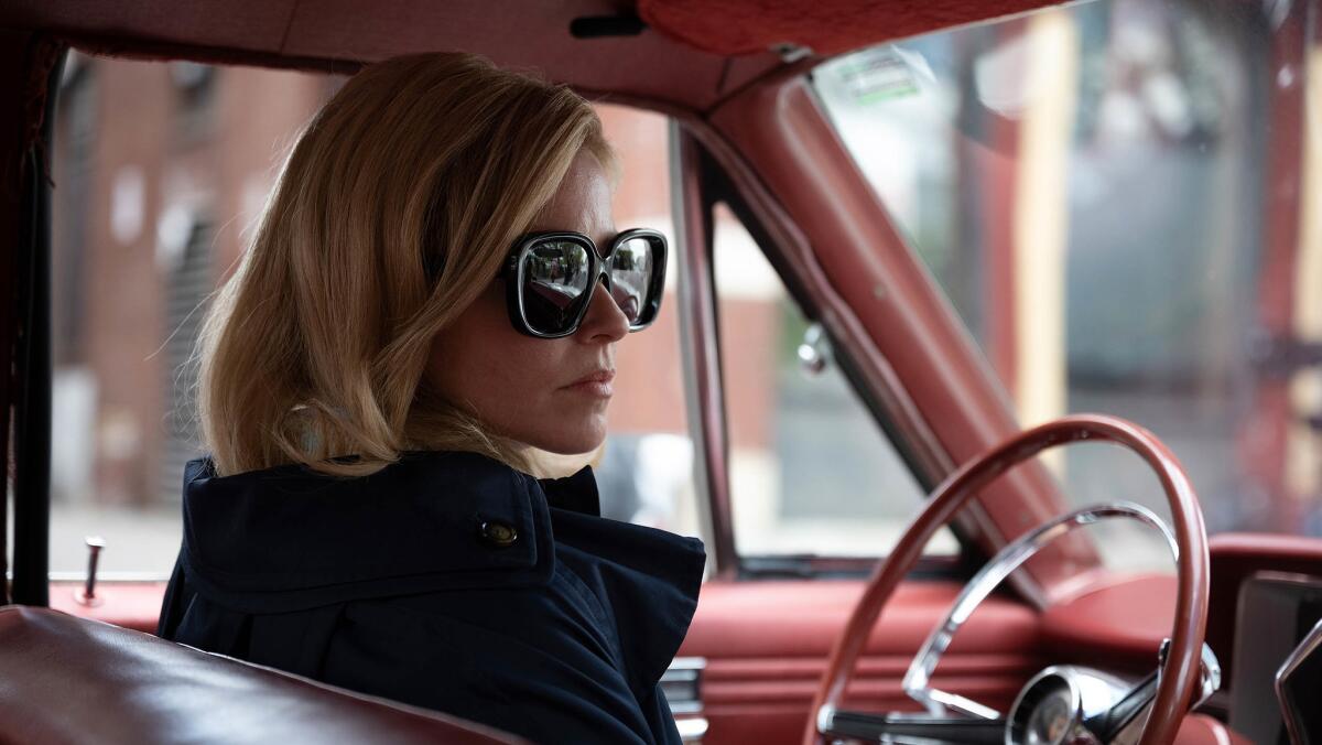 Elizabeth Banks sits in the driver's seat of a car in a scene from 'Call Jane'