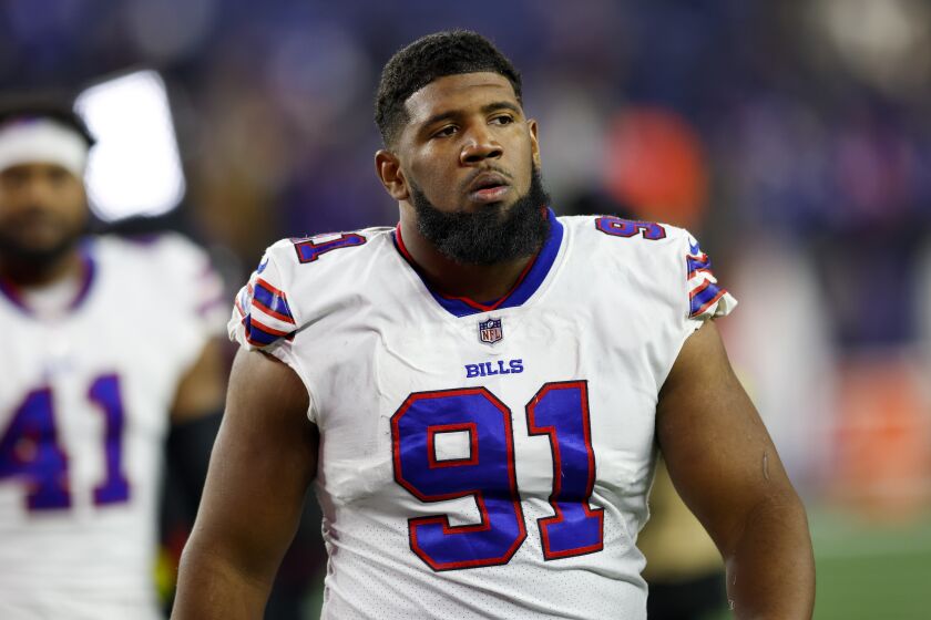 FILE - Buffalo Bills defensive tackle Ed Oliver (91) reacts after defeating the New England Patriots in an NFL football game Dec. 1, 2022, in Foxborough, Mass. The Bills are locking up Oliver through the 2027 season by reaching an agreement to a four-year contract extension, a person familiar with negotiations told The Associated Press, Saturday, June 3, 2023. The person spoke to The AP on the condition of anonymity because the contract has not yet been signed. (AP Photo/Greg M. Cooper, File)