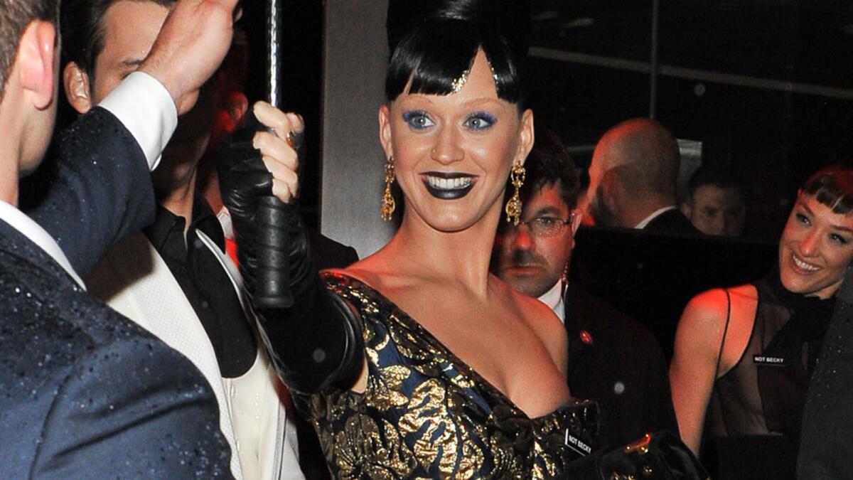 Katy Perry arrives for a Met Gala after-party in New York City on Monday wearing a "Not Becky" nametag.