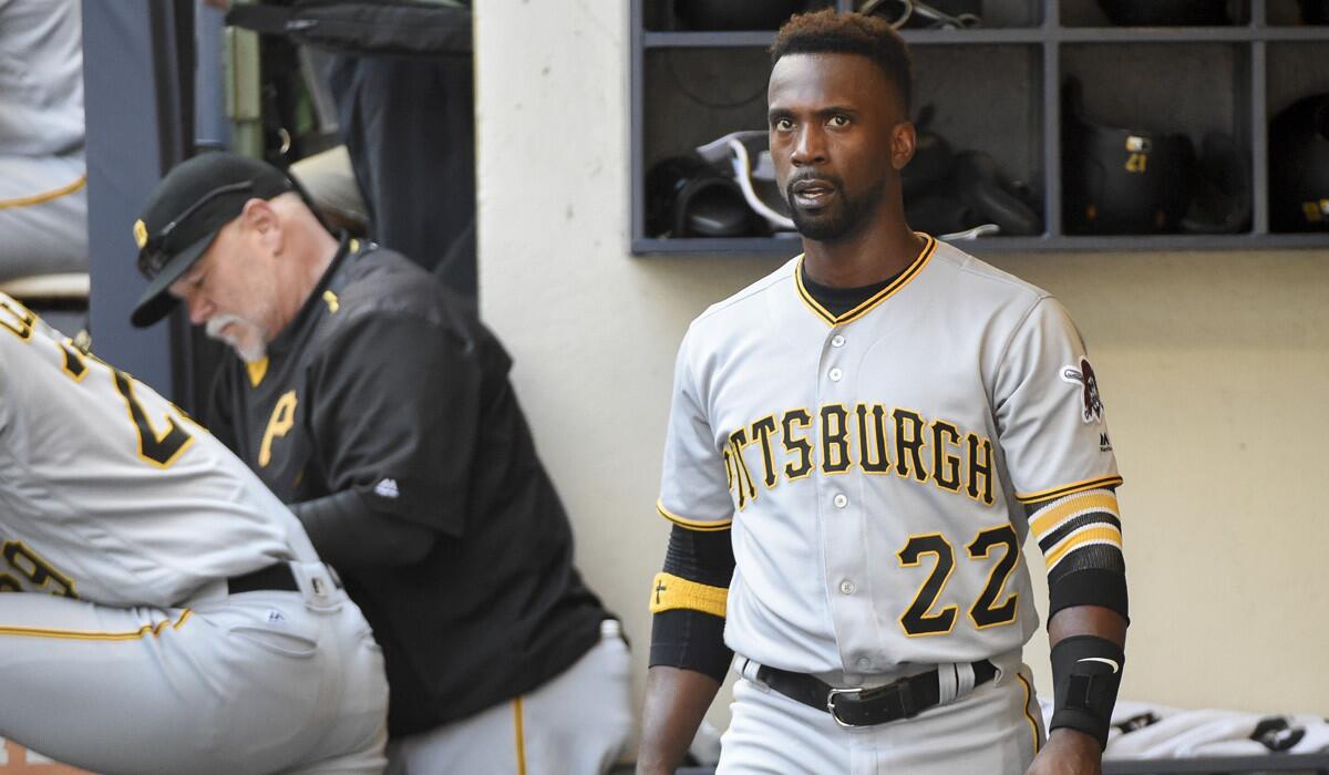 Pittsburgh Pirates' Andrew McCutchen watches the game from the dugout during the sixth inning against the Milwaukee Brewers on Sunday.