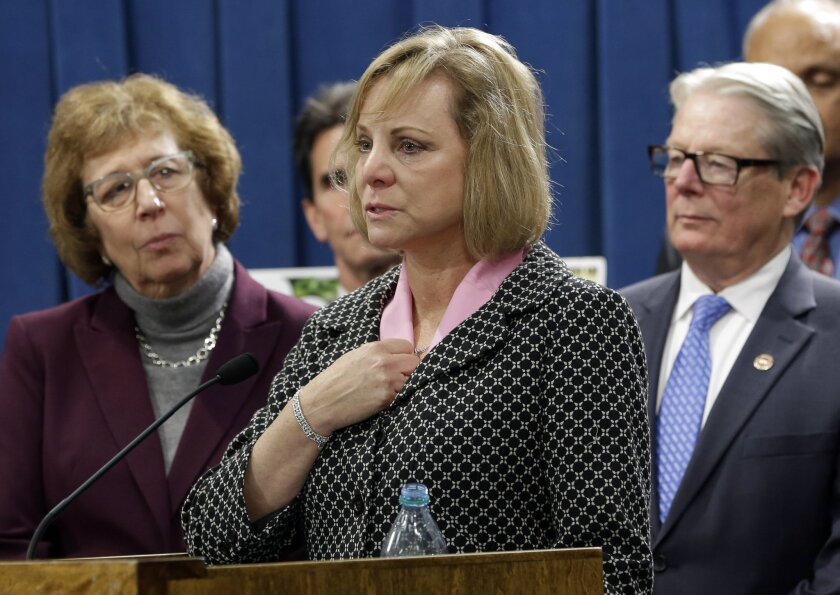 Debbie Ziegler, center, the mother of Brittany Maynard, speaks in support of proposed legislation allowing doctors to prescribe life-ending medication to terminally ill patients during a news conference at the Capitol in Sacramento on Jan. 21, 2015. A bill, authored by Sen. Lois Wolk (D-Davis), left, and Sen. Bill Monning (D-Carmel), right, that would allow California physicians to help terminally ill patients end their lives, was shelved, likely until next year, on Tuesday.