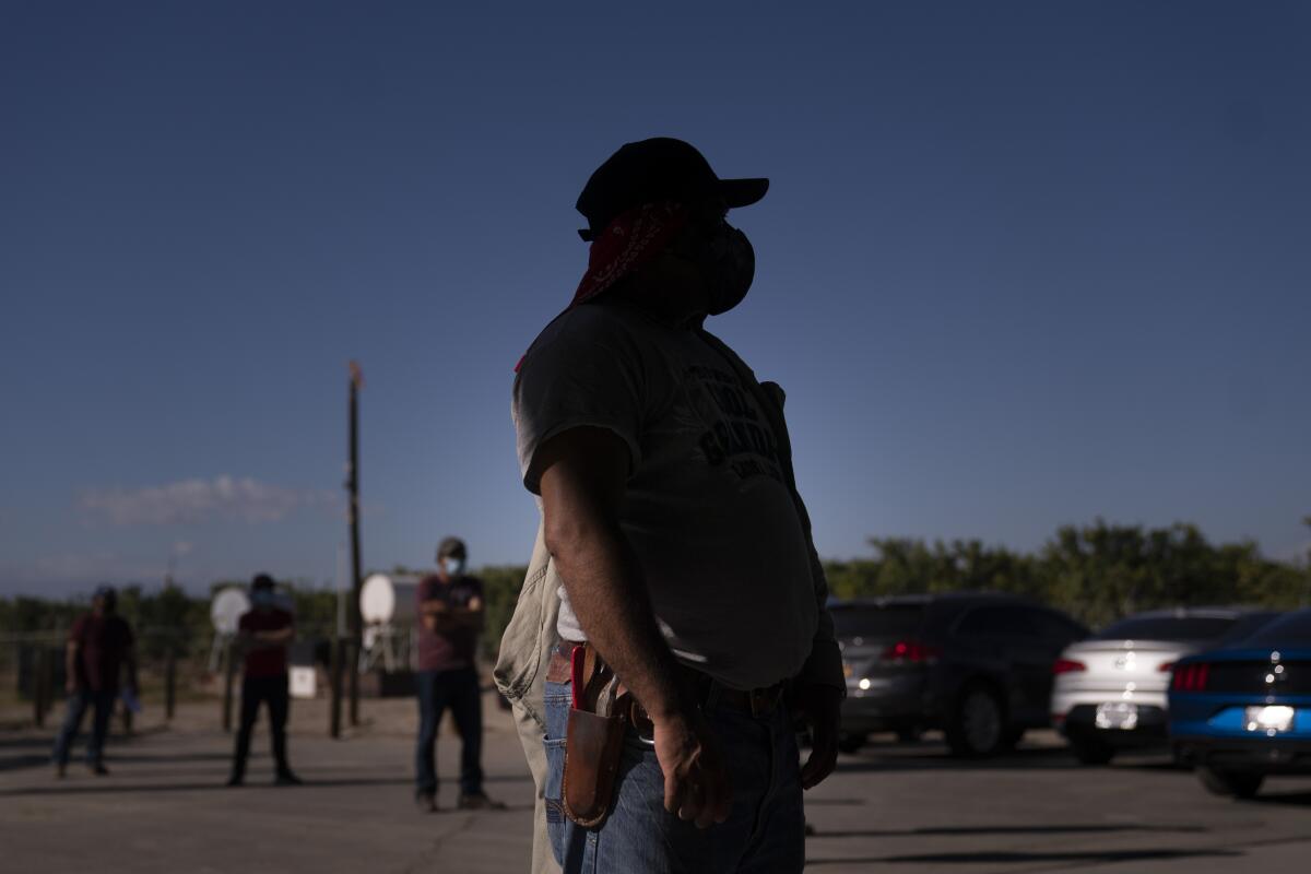 Farmworkers in Mecca, Calif., Thursday, Jan. 21, 2021.