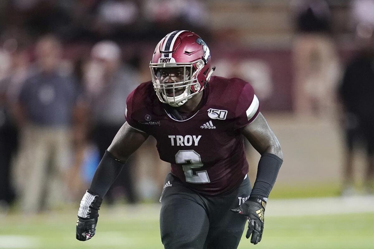 FILE - Troy linebacker Carlton Martial (2) plays during an NCAA college football game in Troy, Ala., Saturday, Sept. 14, 2019. Martial is poised to become the all-time leading tackler in FBS history, likely in the next couple of weeks. (AP Photo/Marvin Gentry, File)