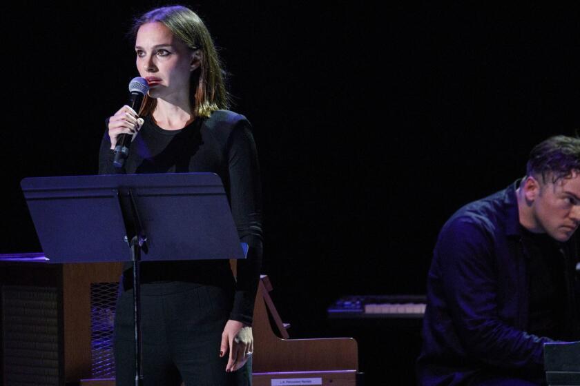 Composer Nico Muhly performs live with actress Natalie Portman, left, during a Center For The Art of Performance (CAP) UCLA concert at The Theatre at Ace Hotel on Friday, May 10, 2019 in downtown Los Angeles, CA. (Patrick T. Fallon/ For The Los Angeles Times)