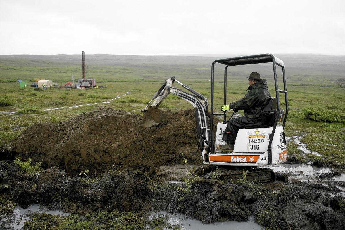 A worker for the massive proposed Pebble Mine test drills near Iliamna, Alaska, in 2007.