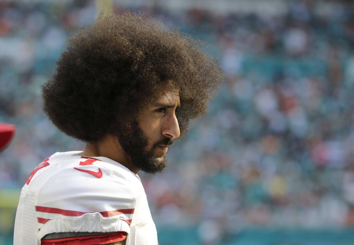 San Francisco 49ers quarterback Colin Kaepernick looks on from the sidelines during a game against the Miami Dolphins on Nov. 27.