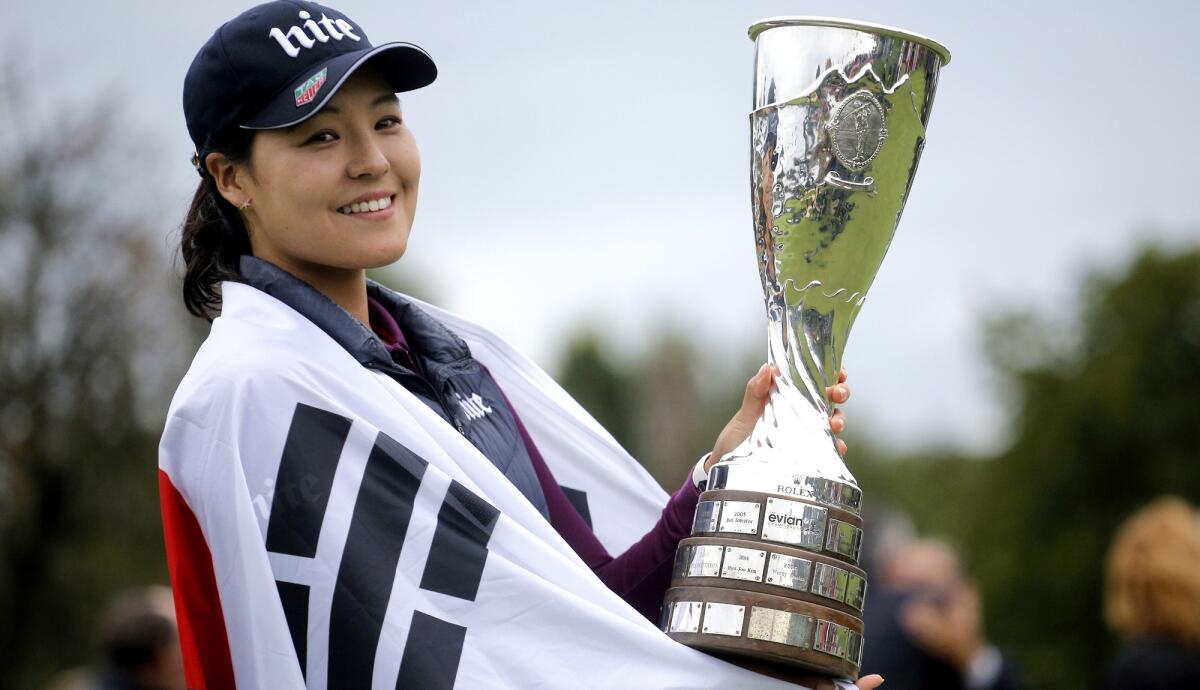 In Gee Chun, wrapped in a South Korean flag, celebrates after winning the Evian Championship on Sunday.