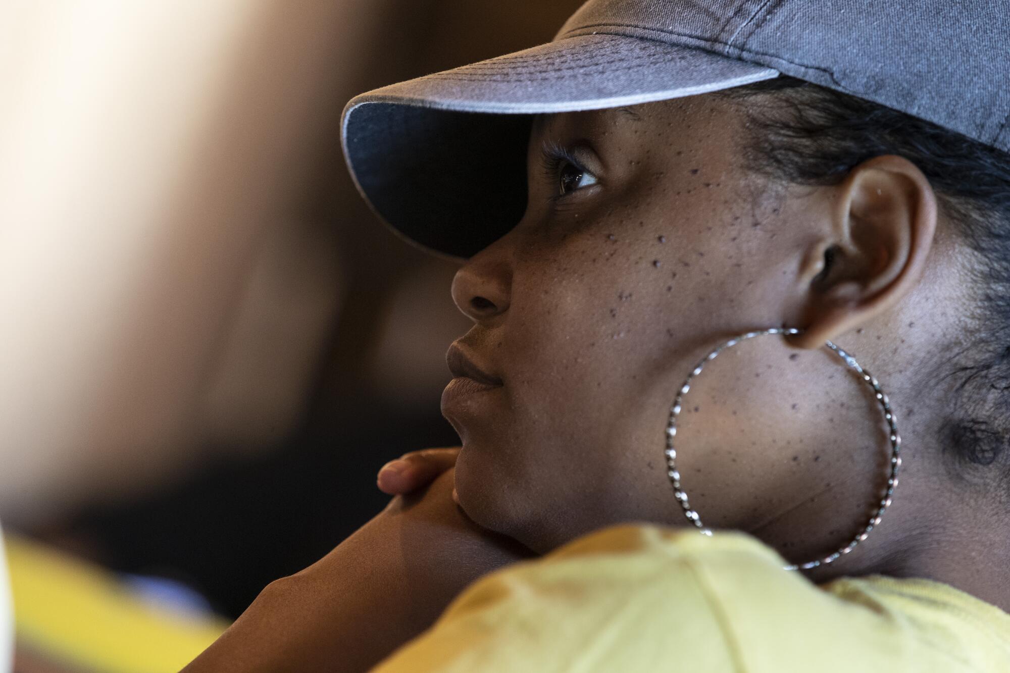 Melissa Phillips listens as women talk about the challenges of caring for a family member 