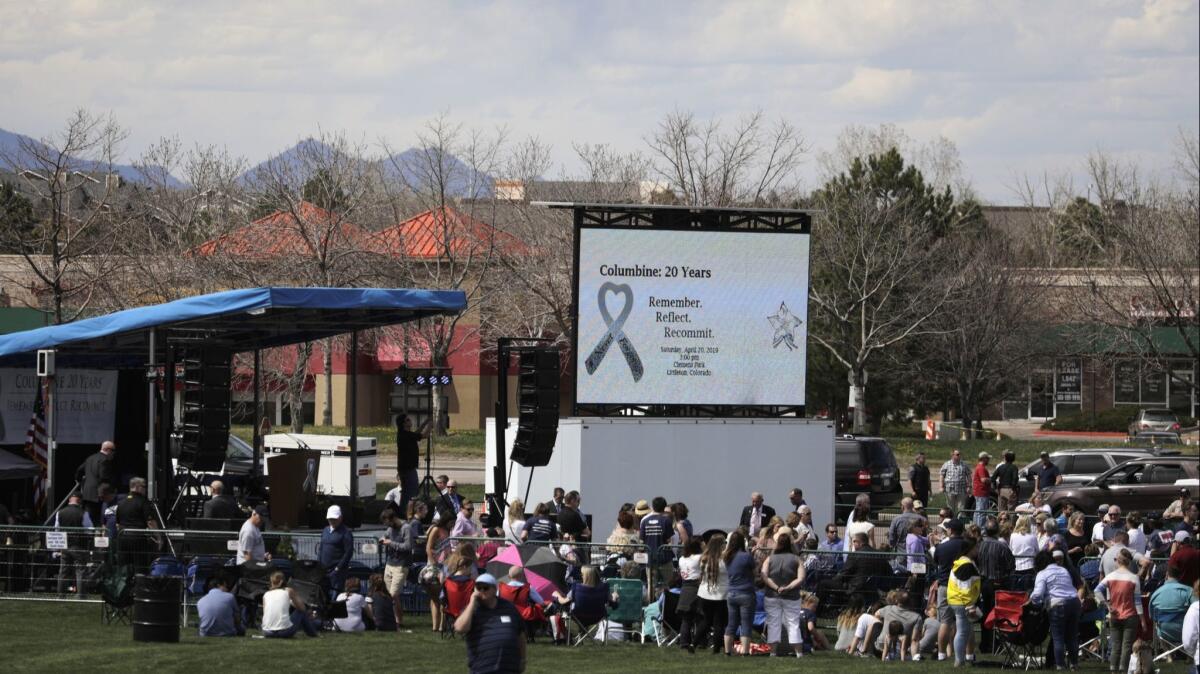 A crowd gathers for a remembrance ceremony April 20, 2019, in Littleton, Colo. Saturday marked 20 years since two Columbine students killed 12 classmates and a teacher.