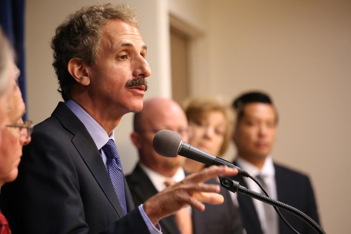 Los Angeles City Atty. Mike Feuer announces his office's settlement with Wells Fargo on Sept. 8.