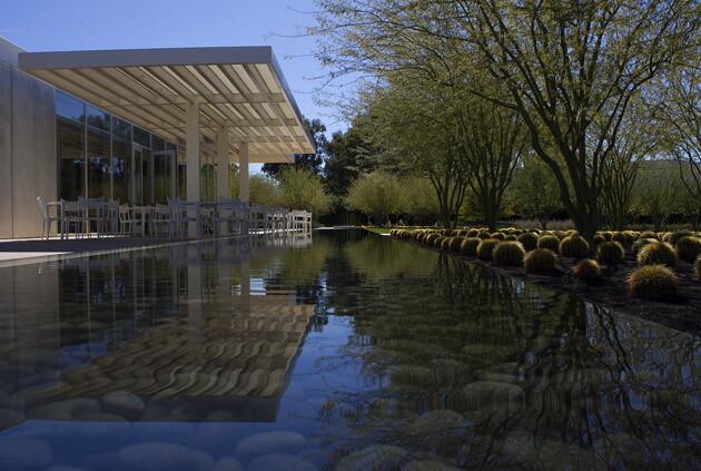 A reflecting pond ripples near a cactus garden in back of the new visitor center.