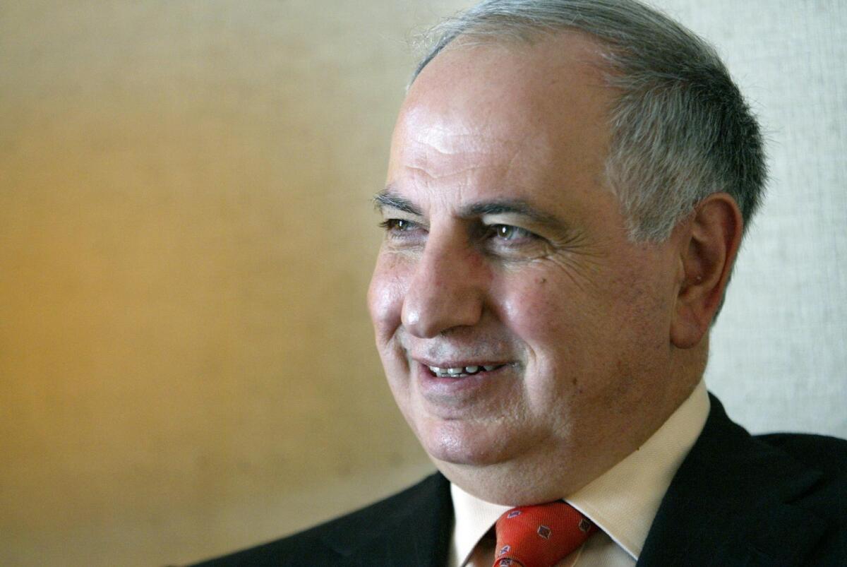 Prominent Iraqi politician Ahmed Chalabi poses for a picture at his hotel room in Tehran 09 August 2004.