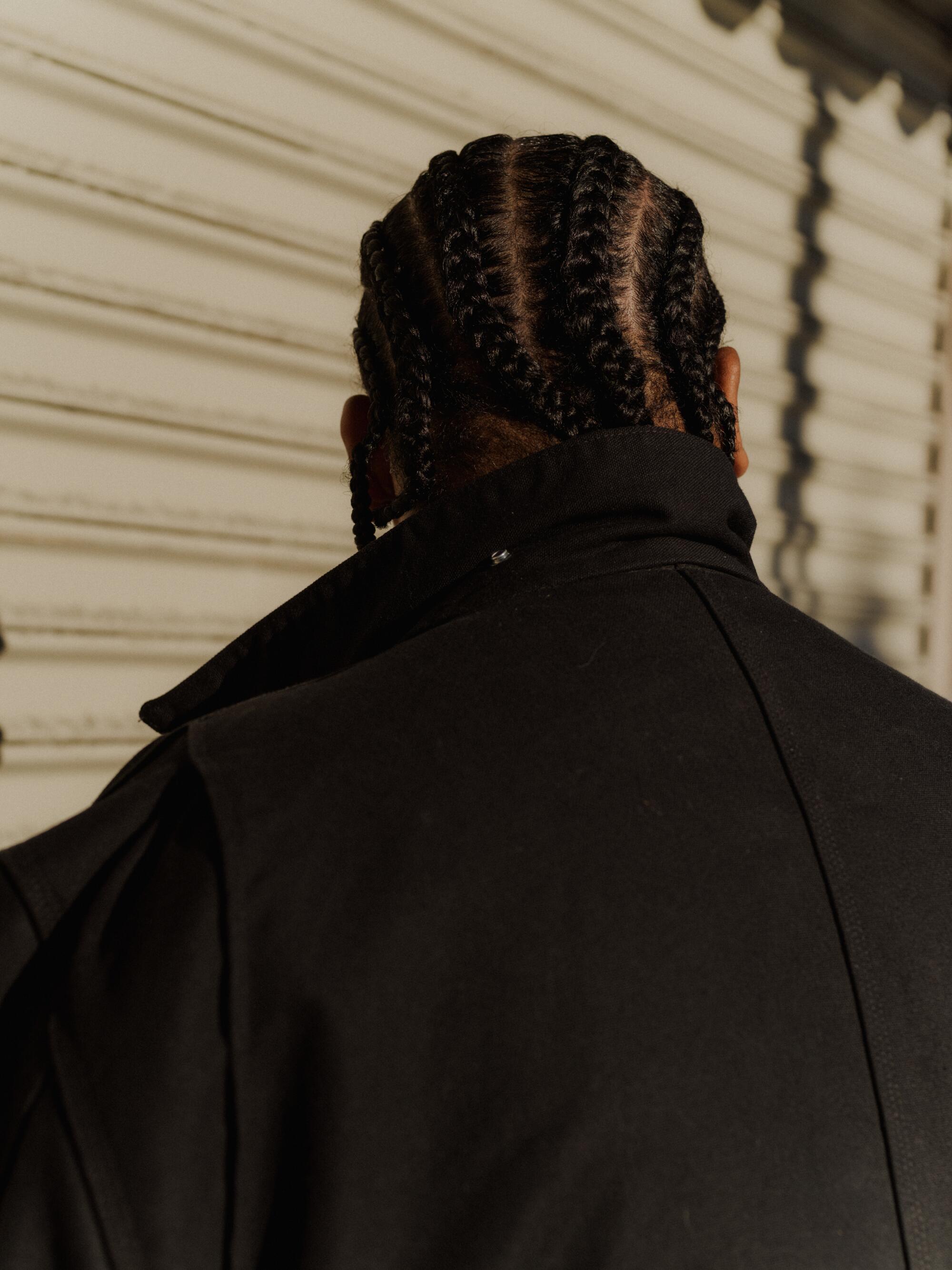 A photo of the back of Garzon's braided head.