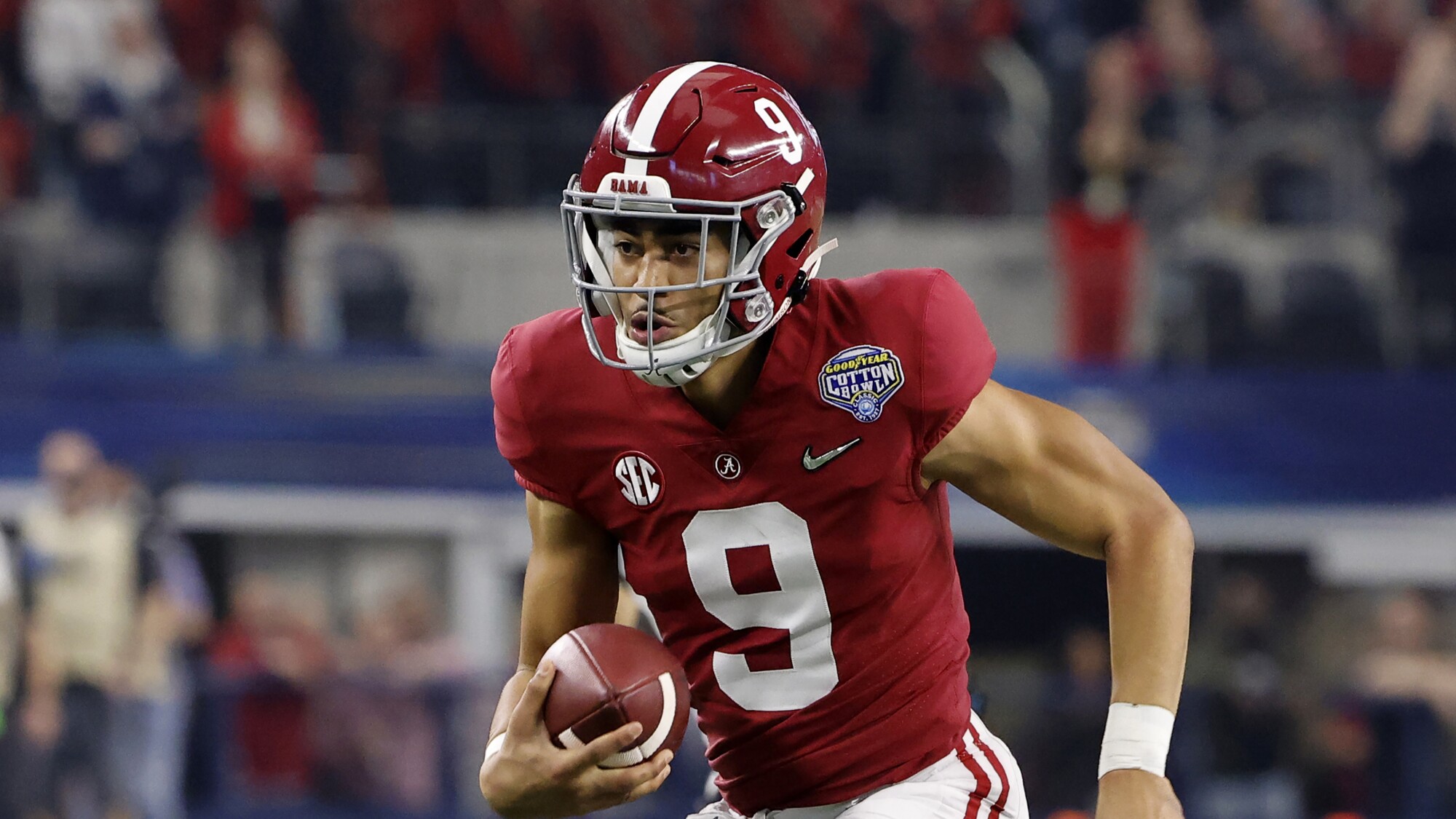 Alabama quarterback Bryce Young runs with the ball against Cincinnati in the Cotton Bowl on Dec. 31.