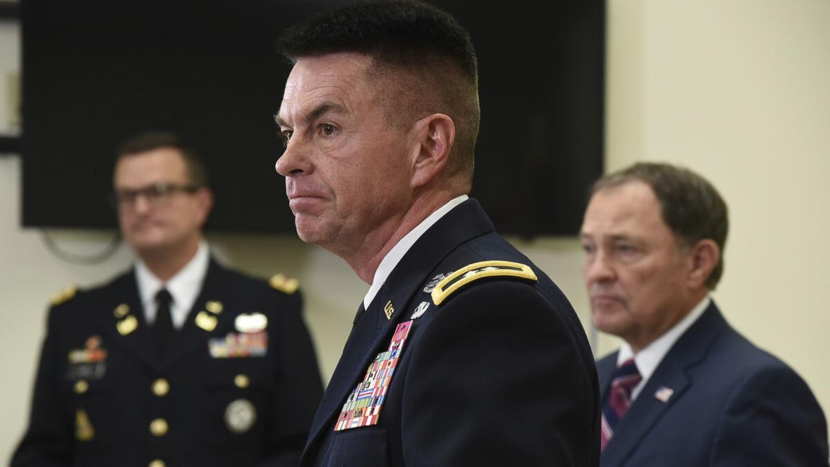 Maj. Gen. Jefferson S. Burton addresses reporters on Sunday in Draper, Utah. Military officials say Brent Taylor, a major in Utah's Army National Guard and mayor of North Ogden, was killed in Afghanistan.
