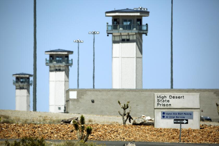FILE - Towers view over the High Desert State Prison in Indian Springs, Nev., April 15, 2015. The mother of a Nevada prisoner who died in custody in April 2023 alleges in a new lawsuit filed late Thursday, April 11, 2024, that her son, Christian Walker, was violently beaten by prison guards and left to die at High Desert State Prison near Las Vegas. (AP Photo/John Locher, File)