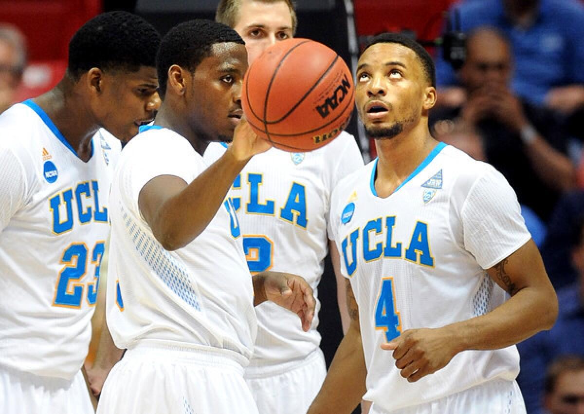 Bruins guards Jordan Adams (with ball) and Norman Powell (4) combined for nearly 29 points a game last season.