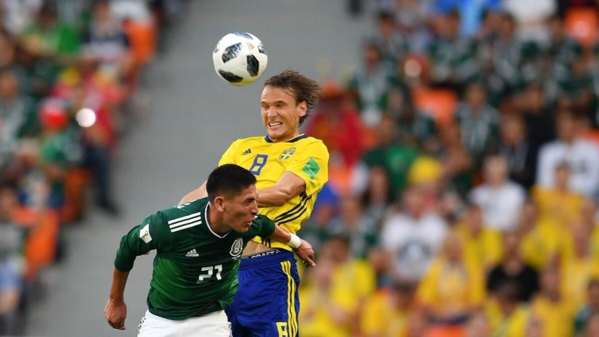 Mexico's Edson Alvarez and Sweden's Albin Ekdal vie for the ball in Yekaterinburg, Russia, on Wednesday.